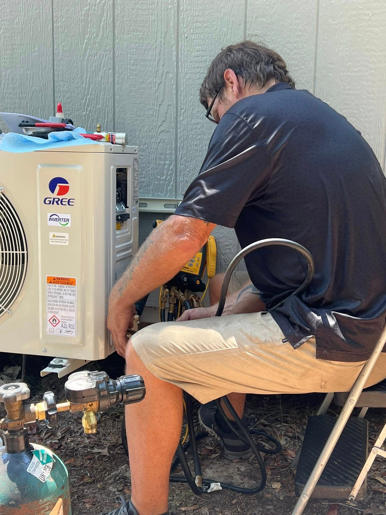 Outdoor air conditioning unit repair in progress in Gainesville, Florida